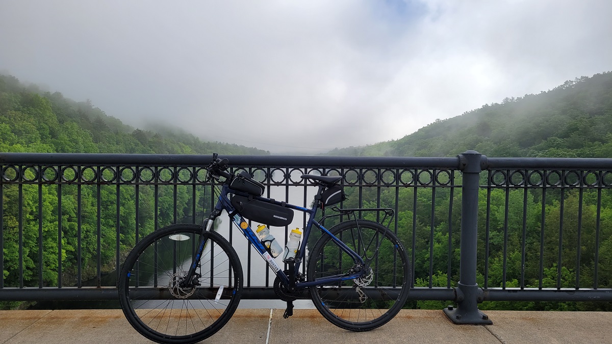 My bike resting on the railing of the French King Bridge, over the Connecticut River